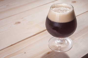 Dark beer on wood table