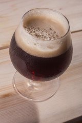 Dark beer on wood table