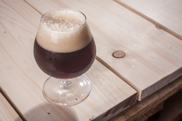Dark beer on wood table