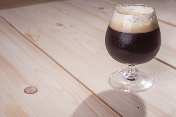 Dark beer on wood table