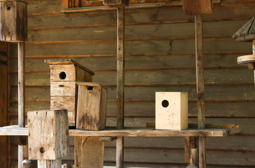 Hand-made bird houses on a table