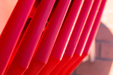 details of stack red chairs from hard plasti