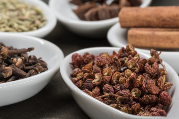 Szechuan Peppercorns in White Spoon