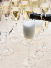 Champagne is poured into glasses