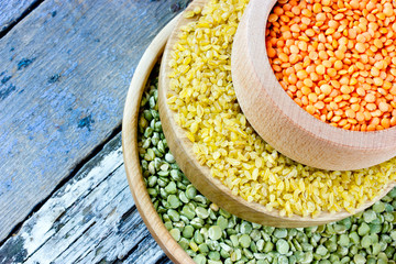 Colorful cereals - red lentils, yellow bulgur and green peas