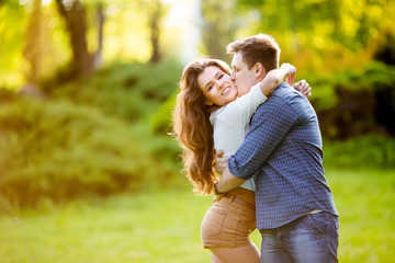 Fototapeta premium loving couple are hugging in park