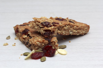 Mueslibar on white wooden background