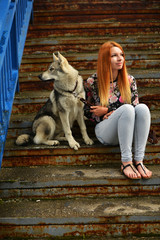Lovely Woman Posing With a Wolf