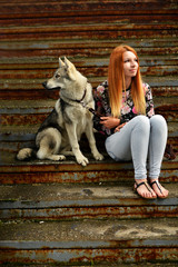 Lovely Woman Posing With a Wolf