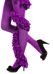 Obraz premium Woman long legs and purple stockings isolated