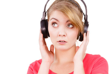 Fototapeta premium Woman sad girl in big headphones listening music