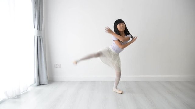 Happy Girl practice ballet dance at home