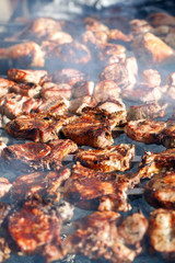 Cooking meat on the fire.