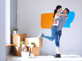 Happy young couple moving in new house