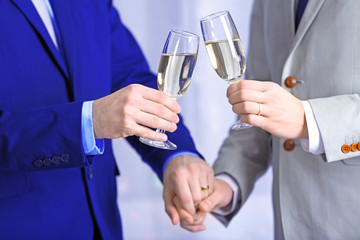 Two homosexuals are going to drink champagne