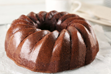 Chocolate cake on paper, closeup