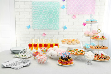 Set of cold snacks, canape, beverages and dessert, closeup