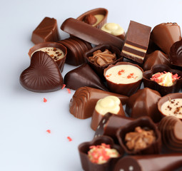 Assorted chocolate candies, isolated on white