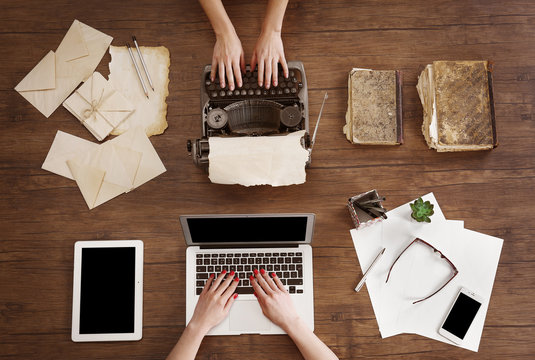 Old Typewriter And Laptop. Concept Of Technology Progress