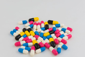 Pills and capsules drug colorful background