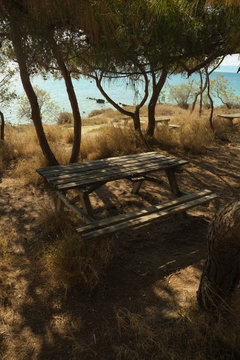 Picnic table next to the beach, aegina, greece