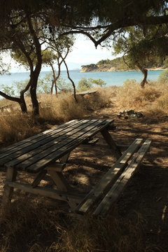 Picnic table next to the beach, aegina, greece