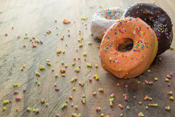 Donuts composition Place on the wooden floor A white background