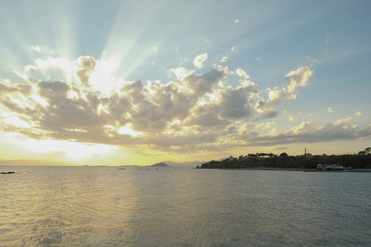 Sea Sunset in Aegina, with wievs to Kolonna ancient ruins, Greec