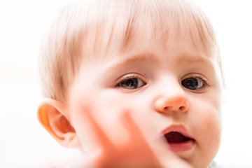 child preventing paparazzi from shooting