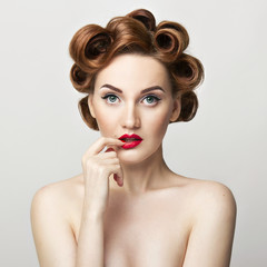 Beautiful woman pinup style portrait. Perfect manicure, makeup and hair.