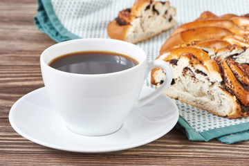 Cup of black coffee and poppy seed cake