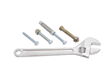 Adjustable wrench and bolts, lag screws and plastic wall plug