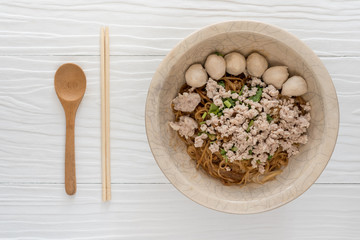 Bowl of noodles with vegetables on wooden table. delicious noodle. Instant noodle. hot noodle.Homemade Quick Ramen Noodles