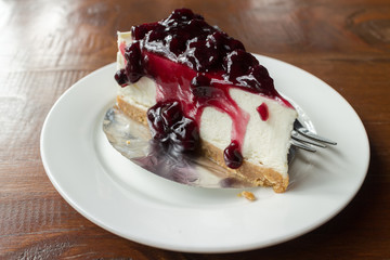 Blueberry cheesecake. Cheesecake with blueberry syrup.