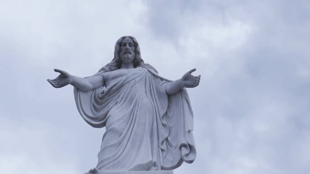 statue of Jesus, the sky with clouds, day, timelapse
