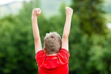 Child celebrating success or victory