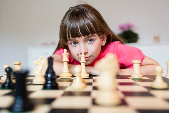 Girl and chess pieces