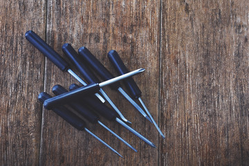 Screwdriver on the Wooden Table