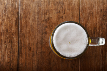 Glass of Beer on the Wooden Table