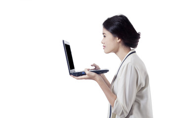 Businesswoman holding a laptop