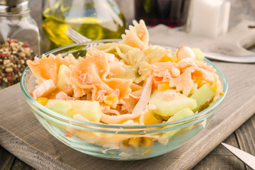 bowl of cold summer salad on wooden