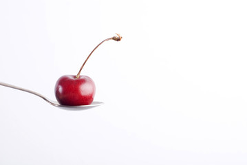 Cherry on spoon