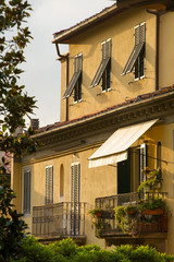 Traditional italian house in sunset light in Lucca, Italy.