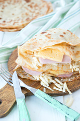 Nourishing pancakes with cheese and ham
