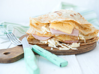Nourishing pancakes with cheese and ham
