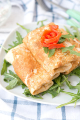 Nourishing pancakes with red fish and cream cheese
