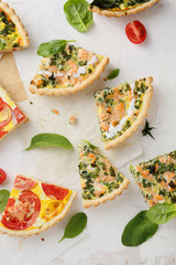 slices quiche with salmon and spinach