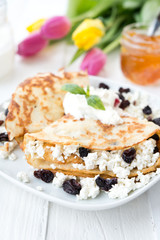 Homemade nourishing pancakes with cottage cheese and raisin
