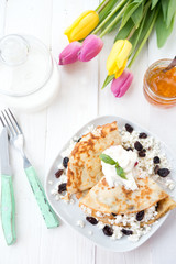 Homemade nourishing pancakes with cottage cheese and raisin

