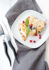 Homemade nourishing pancakes with cottage cheese and raisin
